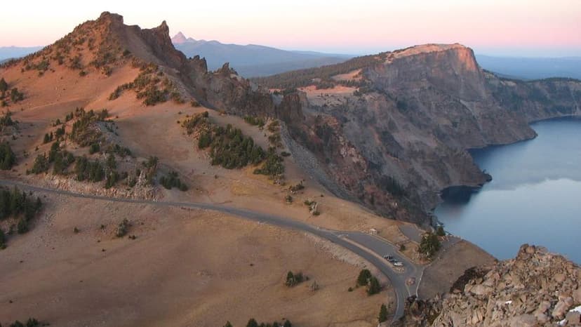 Rim Drive as seen from Watchman Peak runs past a Crater Lake viewpoint.