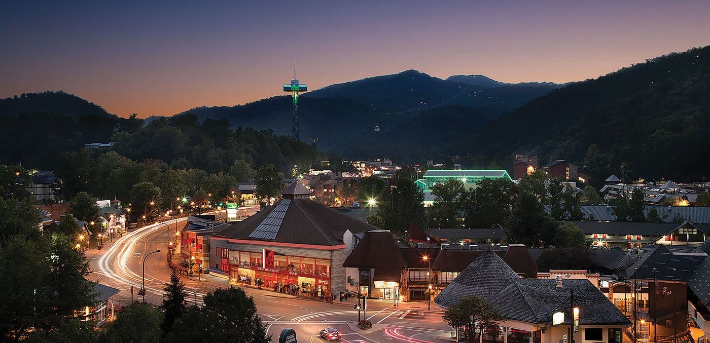 High angel view of Downtown Gatlinburg, Tennessee with the Smoky Mountains in the background